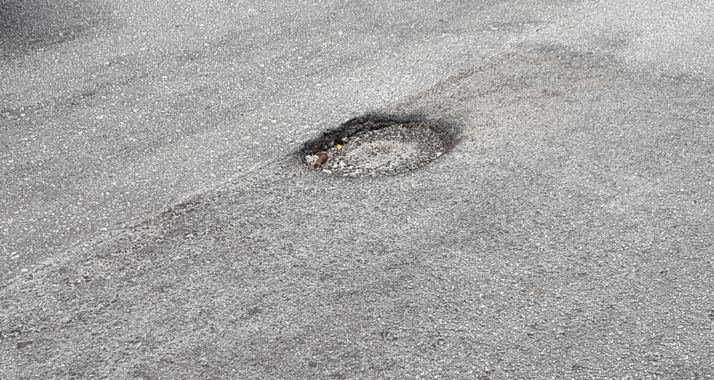 Waze report potholes
