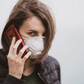 Masked lady on mobile phone