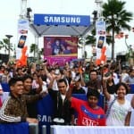 Fans holding up their Samsung GALAXY Y&rsquo;s while waiting in line for free LMFAO tickets.